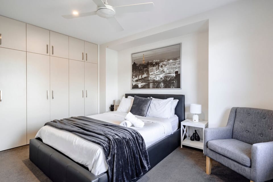 Bedroom 3: Spacious bedroom with built-in wardrobe and reading chair included.