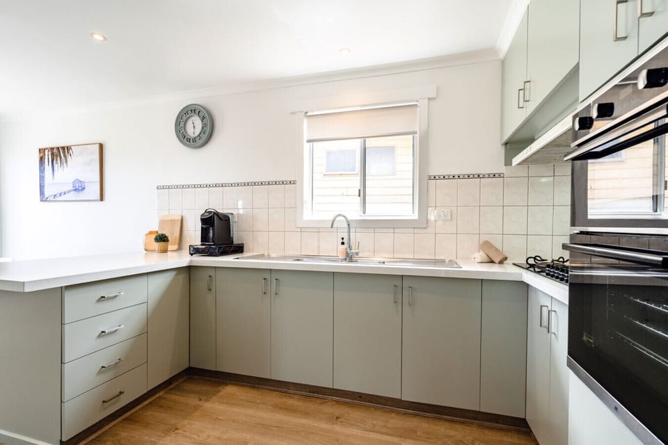 Functional U-shaped kitchen with ample storage and workspace.