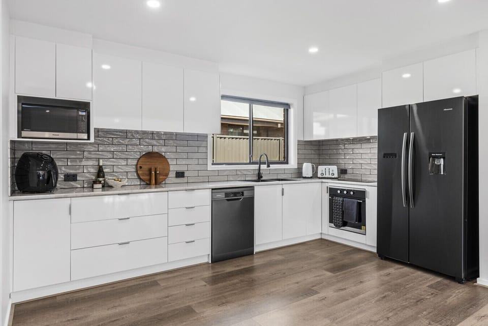 A sleek, fully equipped kitchen ready for everything from quick bites to home-cooked meals.