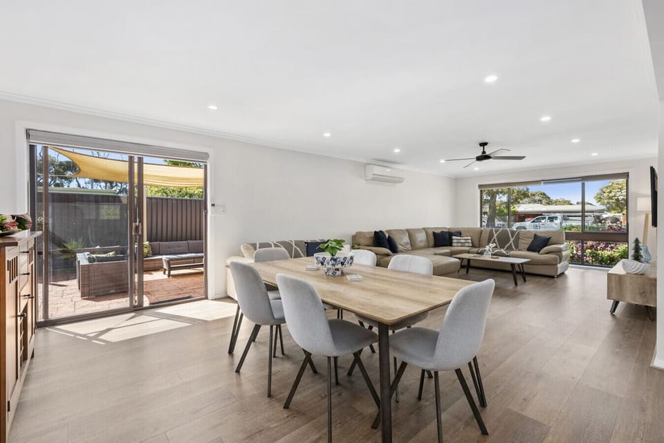 A bright open space that brings everyone together—dine, relax, and step straight out to the patio.