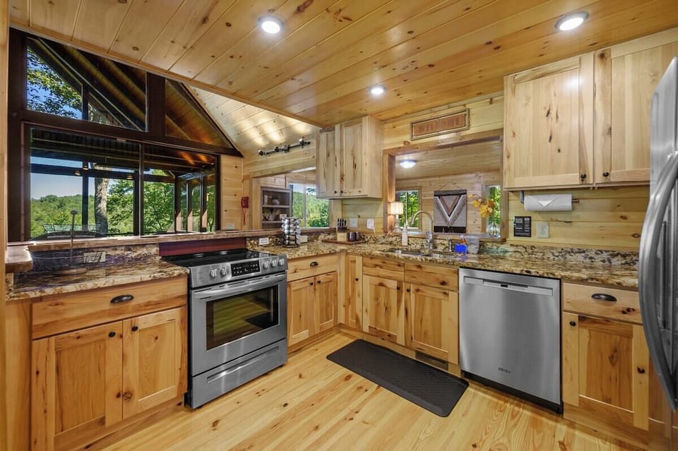 Fully stocked kitchen with granite countertops and stainless-steel appliances