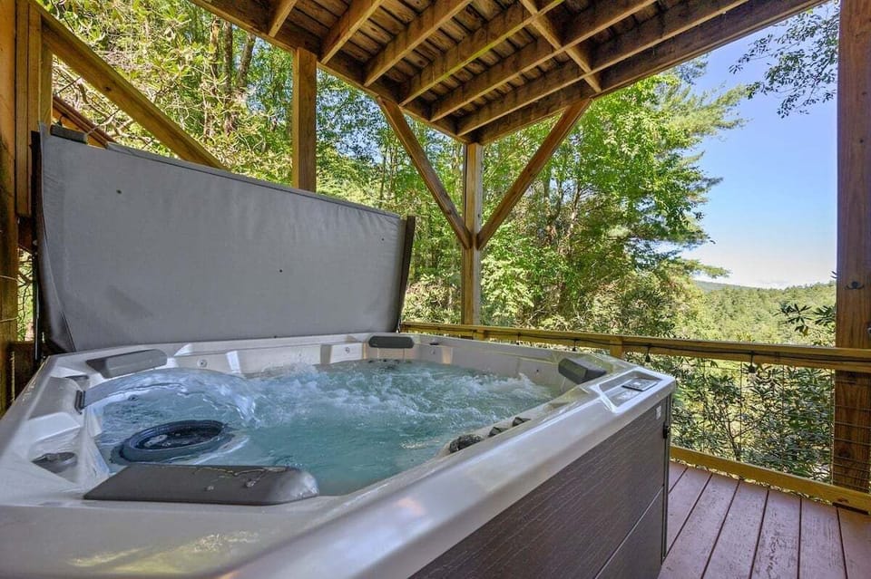 Soak in the hot tub while soaking up the sounds of the Toccoa River rapids!