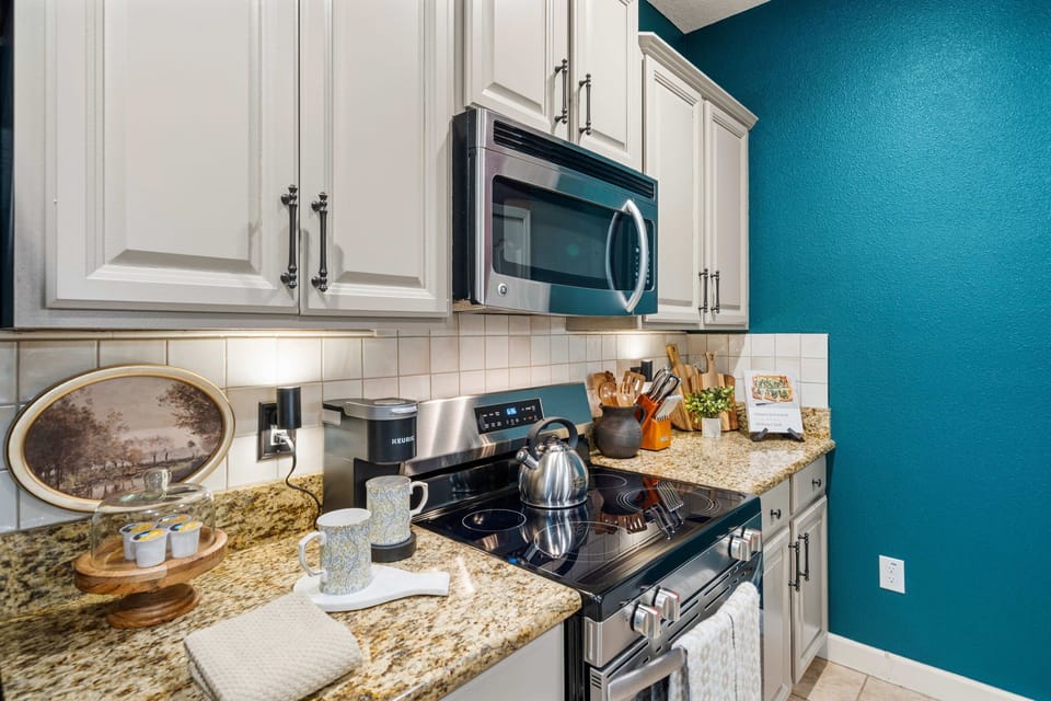 Modern appliances including stove, microwave, and fridge