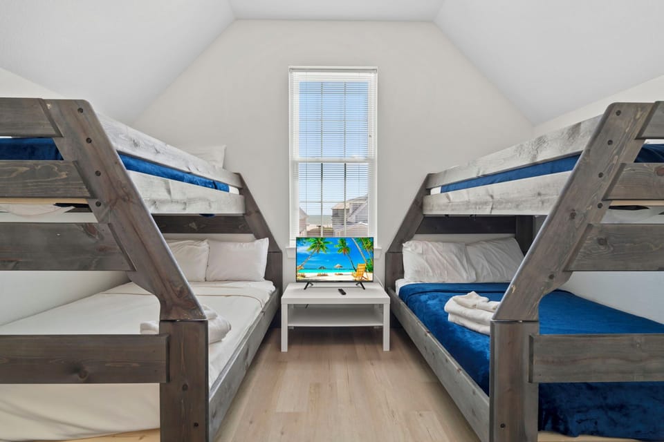 Cozy bunk room with built-in beds, perfect for kids, friends, or group stays.