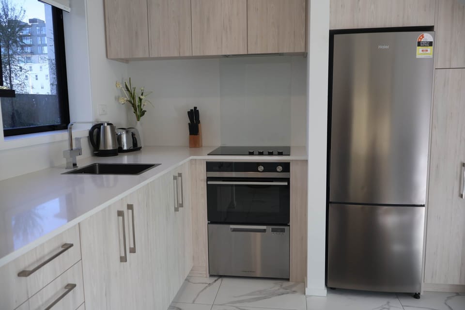 Cook with ease in a full kitchen featuring modern appliances, cookware, and everything you need for 