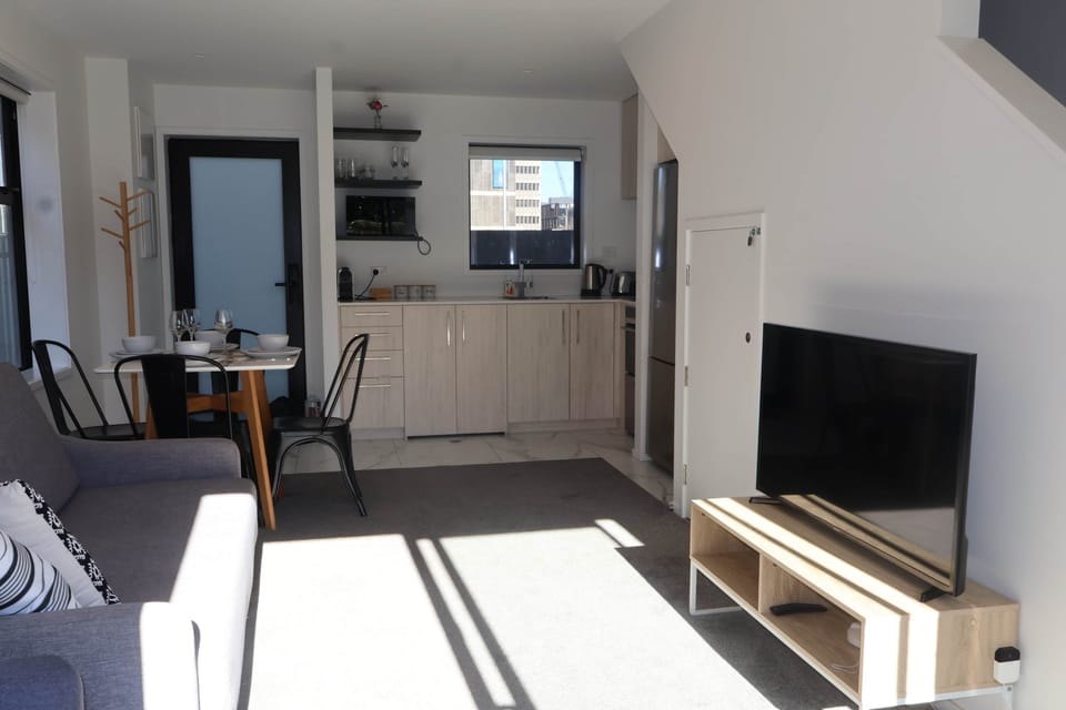 Our open-plan layout connects the kitchen, dining, and living areas, creating a bright and social sp