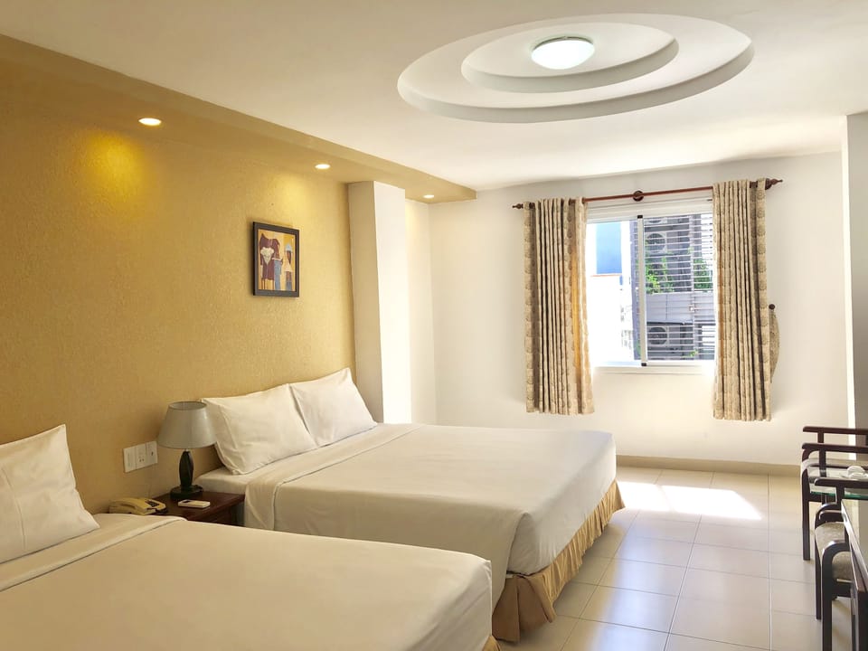 Family Room | Minibar, in-room safe, desk, blackout drapes