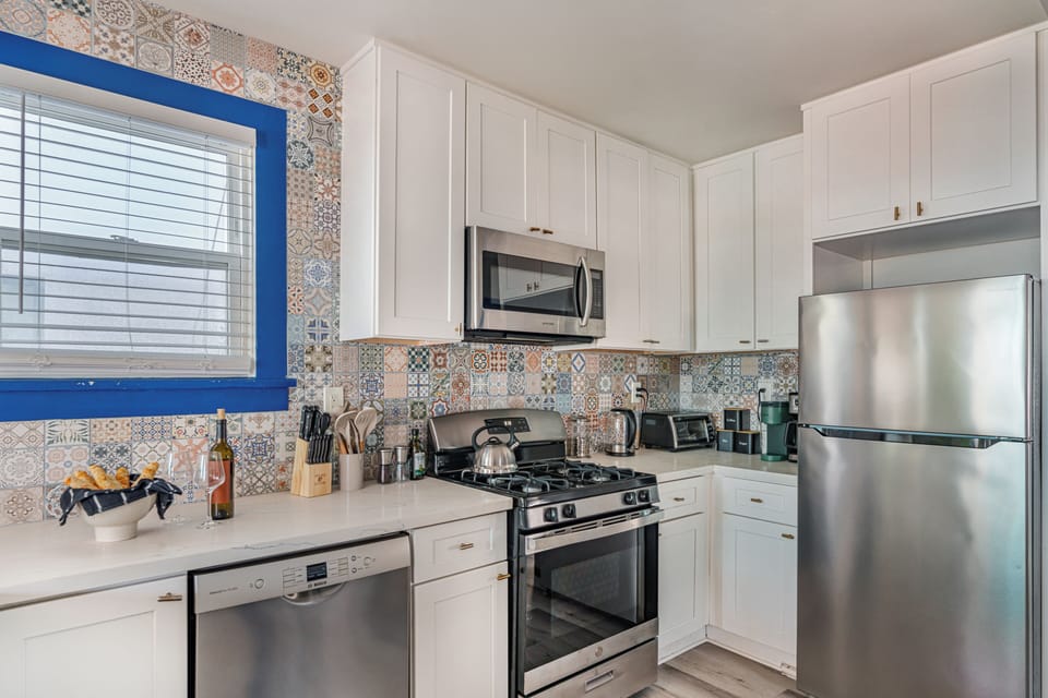 Sleek countertops and a full-sized dishwasher make clean-up a breeze.