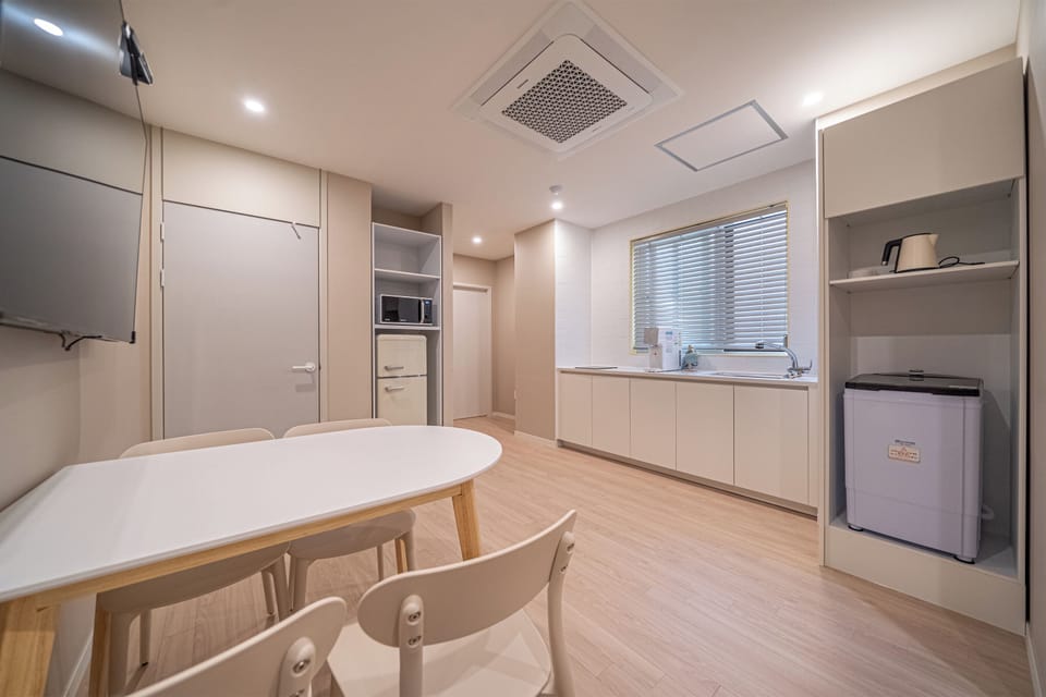 Family Room, City View | Private kitchen | Fridge, microwave