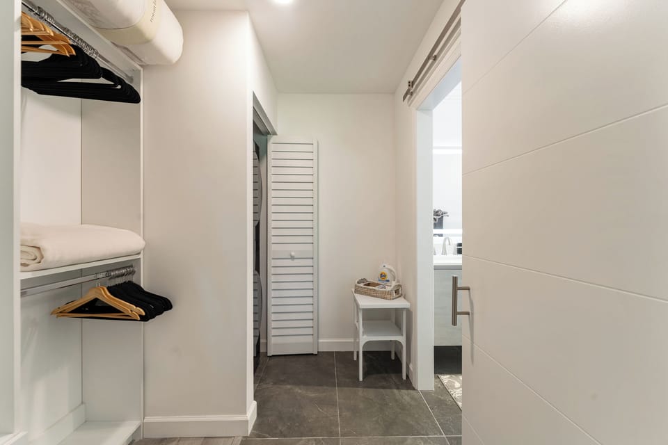 Spacious walk-in closet, large capacity washer/ dryer.