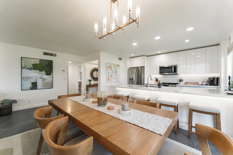 Open-concept dining area connecting seamlessly to kitchen and living room