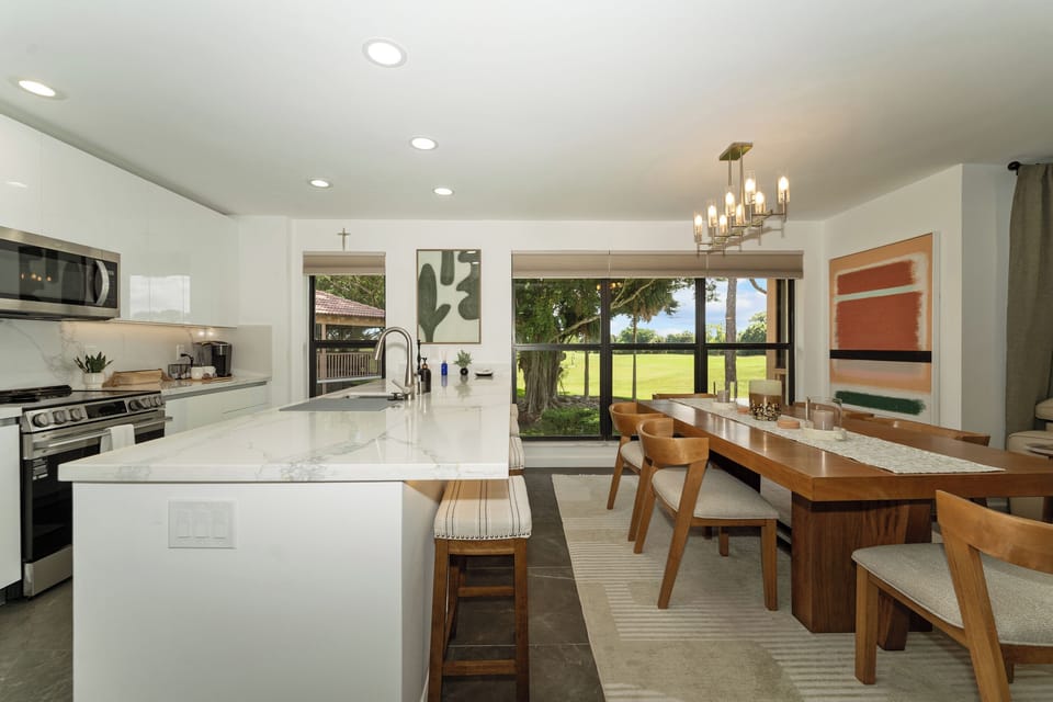 Open-concept dining area connecting seamlessly to kitchen and living room