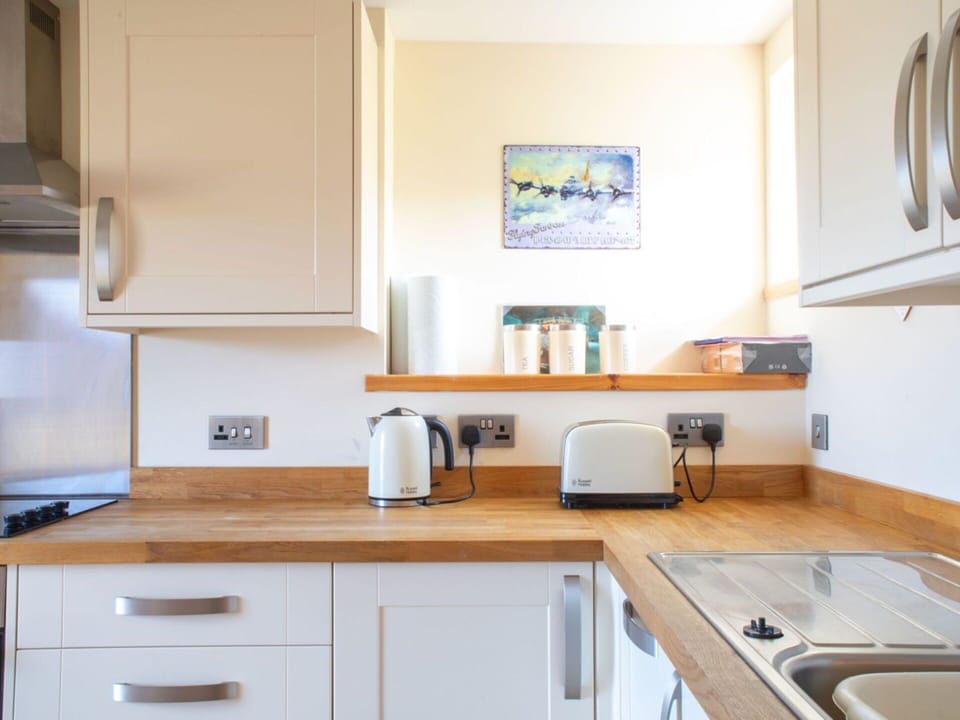 Interior Design, Countertop, Furniture, Kitchen, Flooring, Cabinetry, Kitchen Appliance, Wood, Major Appliance, Room