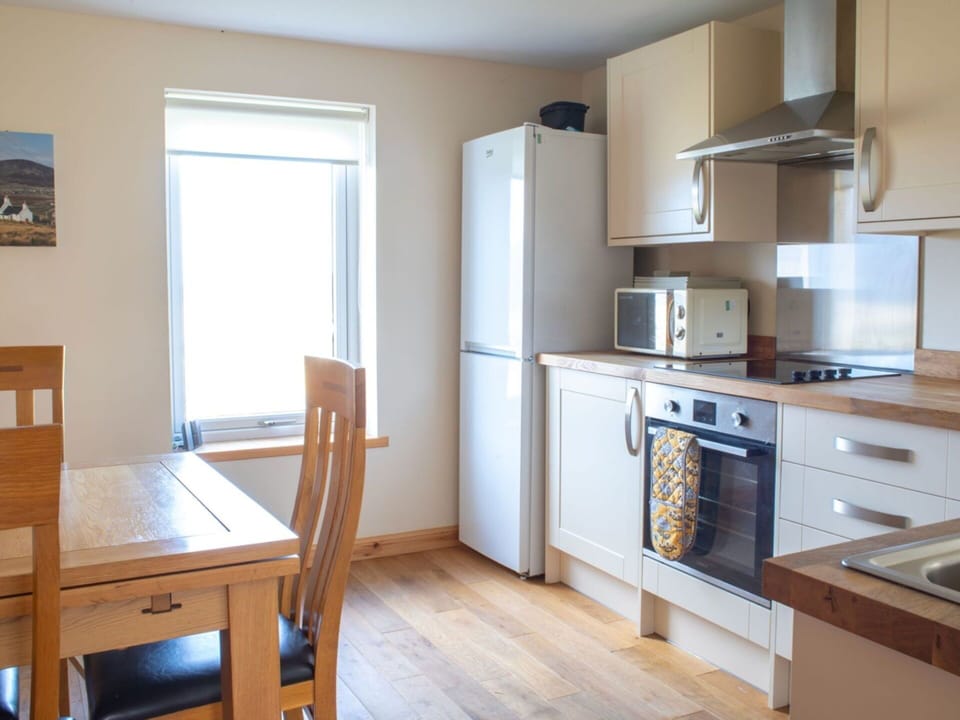Furniture, Flooring, Wood, Floor, Interior Design, Major Appliance, Cabinetry, Room, Countertop, Kitchen