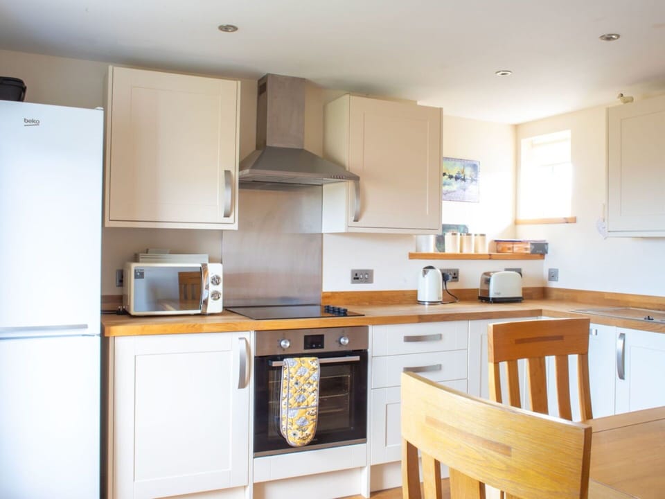 Kitchen Appliance, Kitchen, Furniture, Countertop, Cabinetry, Interior Design, Major Appliance, Flooring, Home Appliance, Wood