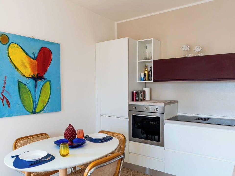 Furniture, Interior Design, Flooring, Wood, Kitchen, Countertop, Kitchen Appliance, Floor, Cabinetry, Room