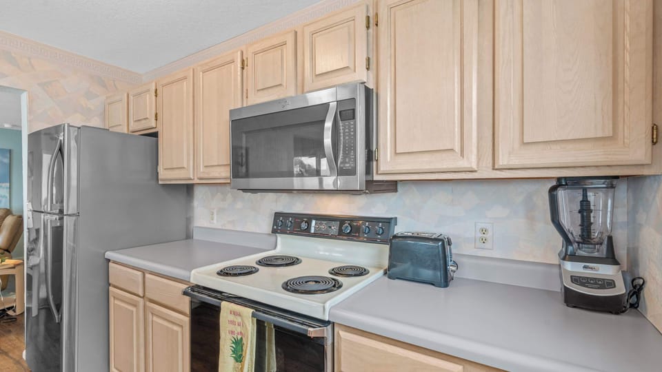 The open kitchen offers ample space & all the comforts of home​