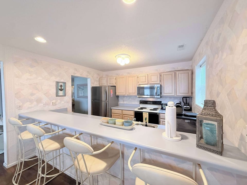 The open kitchen offers ample space & all the comforts of home​
