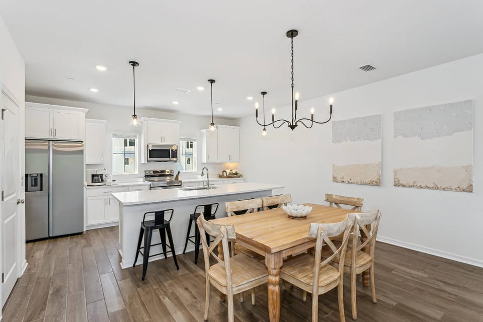 Stylish Kitchen/dining area with modern finishes and ample seating is ideal for easy meal prep and relaxed gatherings.
