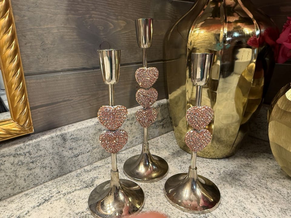 Romantic evenings await with glittering heart-adorned candle holders and champagne chilling beside you—your celebration starts here.