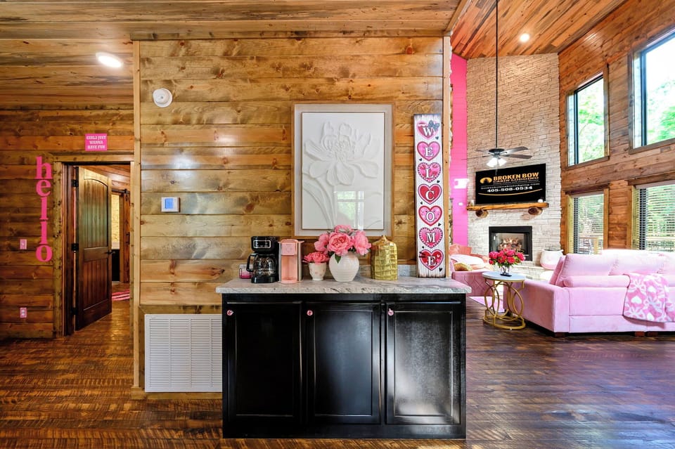 Imagine your mornings starting in this beautifully crafted cabin space, where rustic wooden walls meet modern charm. Your own coffee station awaits by the cozy living area with fireplace.