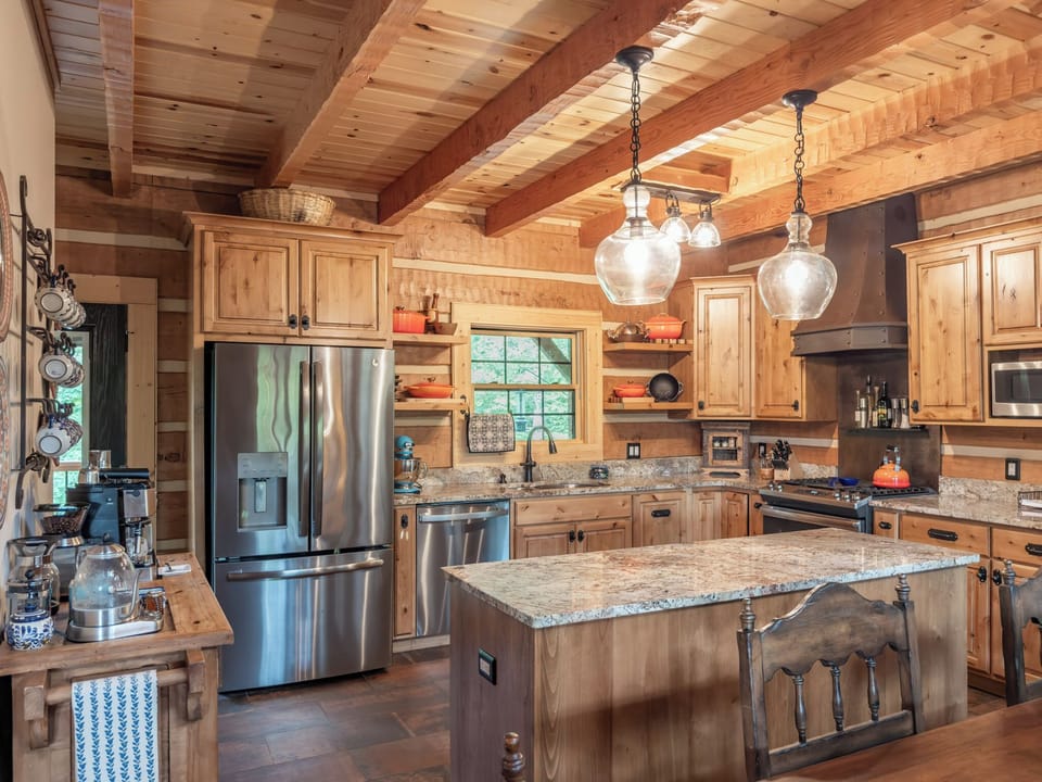 The kitchen is equipped for a gourmet chef, entertaining, or a simple meal.