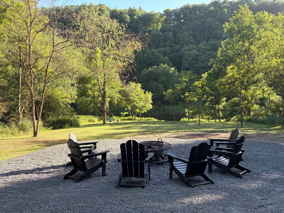 The private river lot has a spacious fire pit area and room to play.