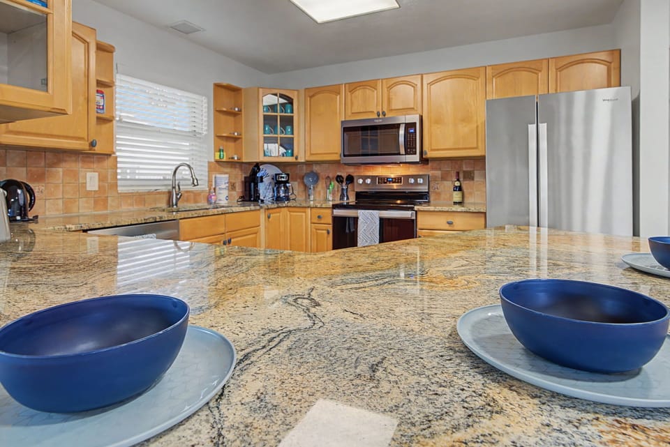 Your fully equipped kitchen features granite counters, stainless appliances, and everything you need to create memorable meals during your stay.