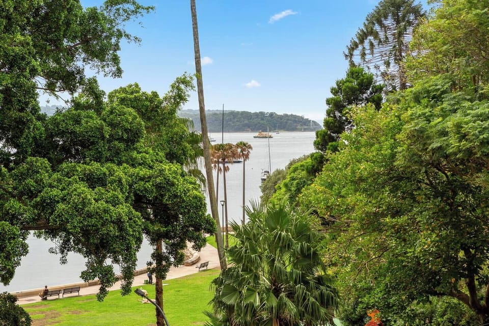 The charming balcony features calming glimpses of the water and the park