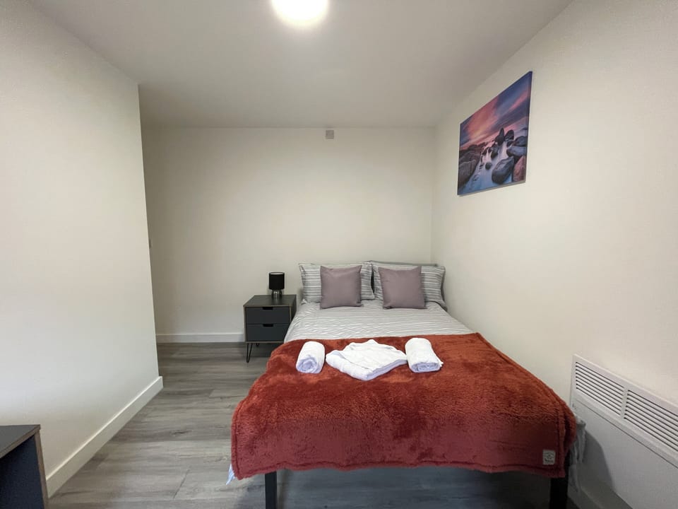 Basic Apartment | Desk, laptop workspace, blackout drapes, iron/ironing board