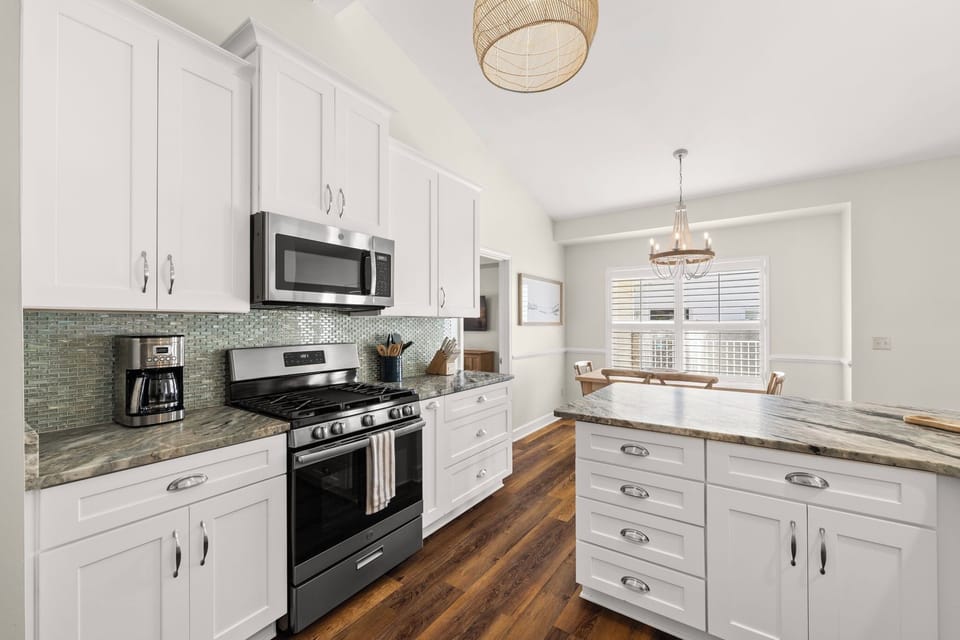 Stainless steel appliances with a gas stove and a Keurig and drip coffee maker 