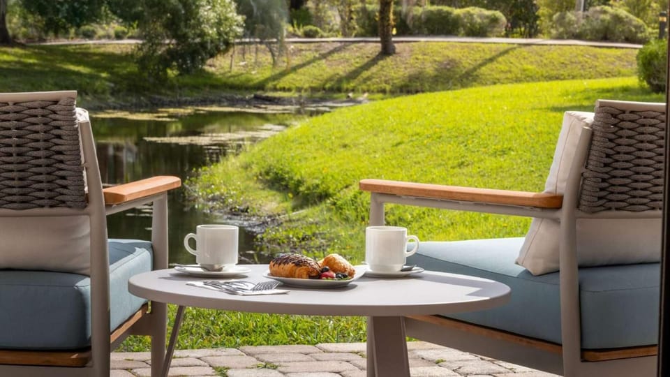 Start mornings with coffee and serene waterway views.
