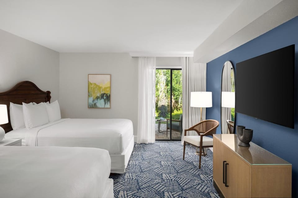 Settle into crisp beds with calming views and big TV.