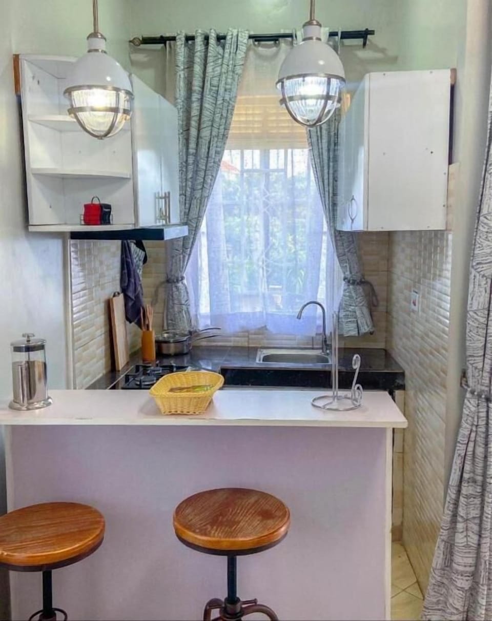 Full-size fridge, microwave, stovetop, cookware/dishes/utensils