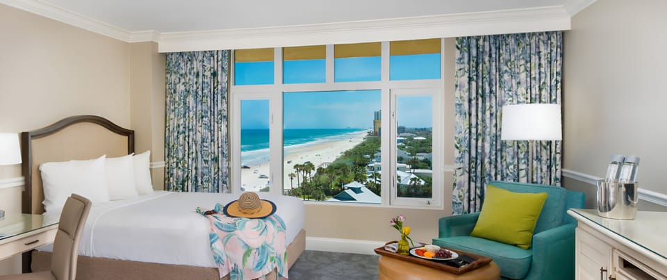Wake up to turquoise ocean vistas from crisp, cloud-soft bedding.