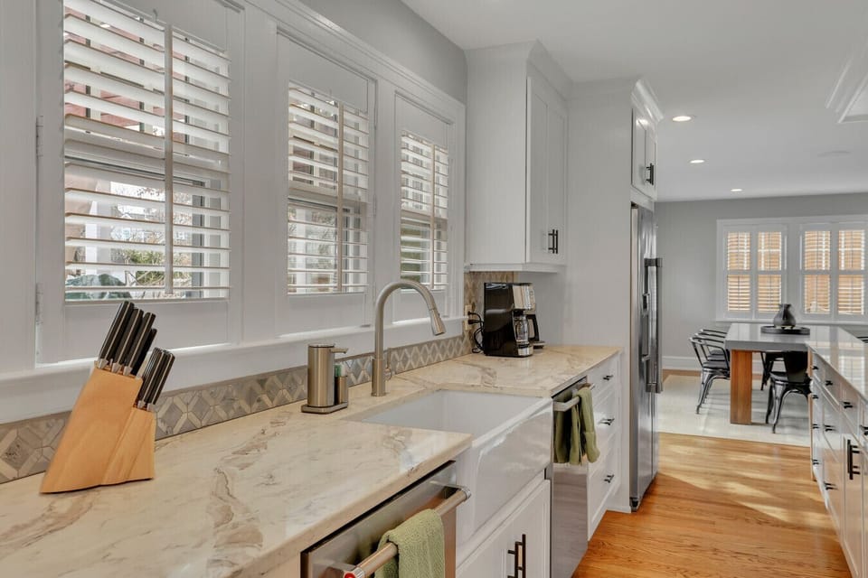Well-equipped kitchen with farmhouse sink and dual dishwashers