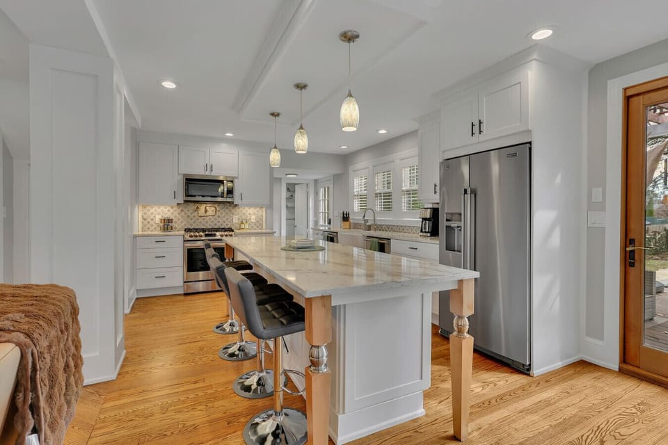 Bright, open kitchen with large island seating—perfect for group meals, entertaining, and gathering together