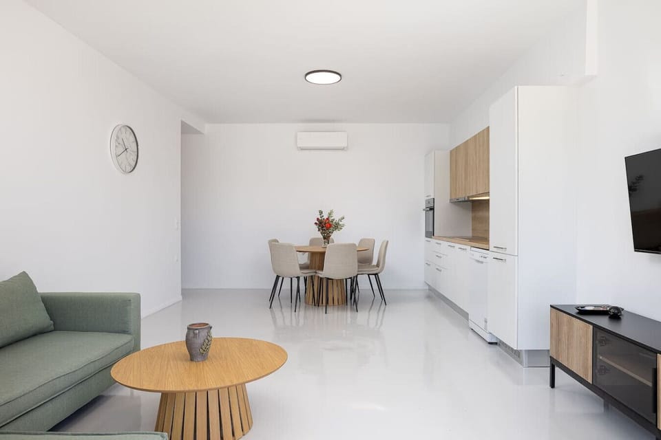 Open living and dining area designed for conversation, comfort, and easy entertaining.