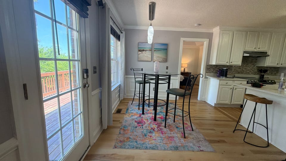 Dining Room and Kitchen with a view of the back deck