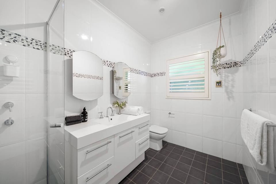 Refresh in the bathroom with a walk-in shower, wide vanity, and bright finishes that make mornings feel clean and simple.