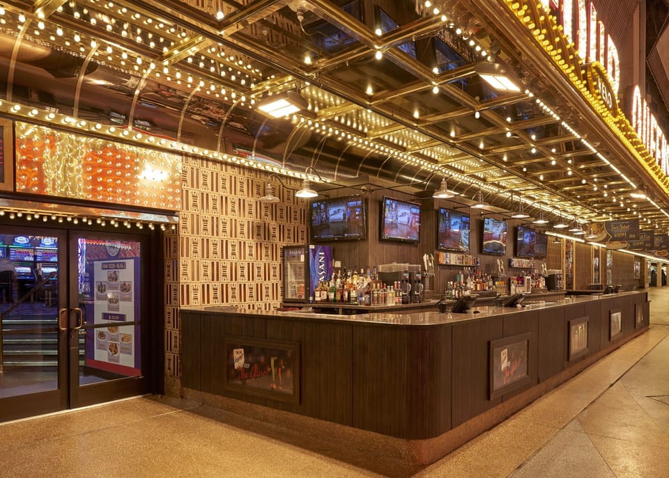 Step into the sparkle with a classic marquee-lit entrance.