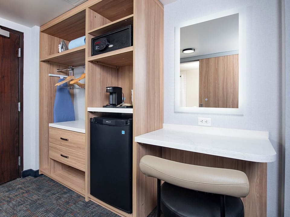 Refresh easily with mini-fridge, coffee station, and in-room safe.