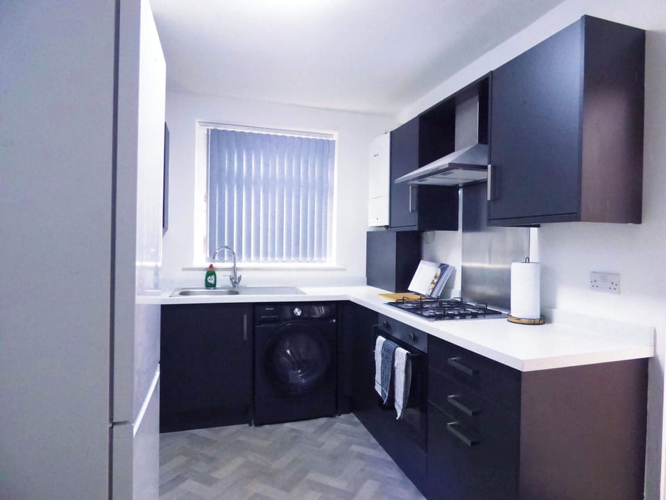 Modern Kitchen: Sleek design with all essentials, perfect for culinary adventures in Manchester!