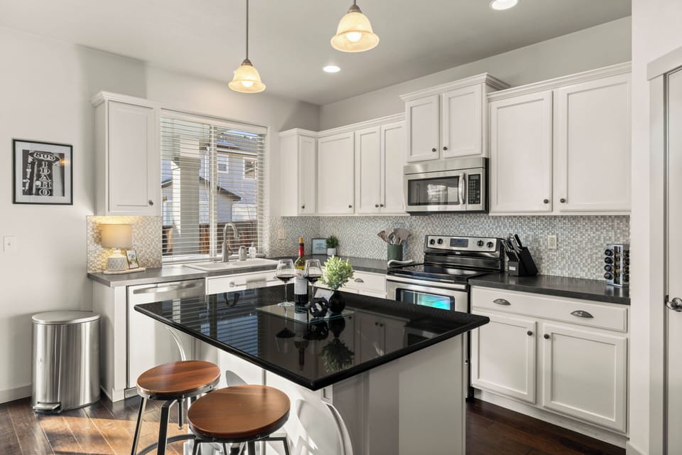 Fully stocked kitchen with stainless steel appliances