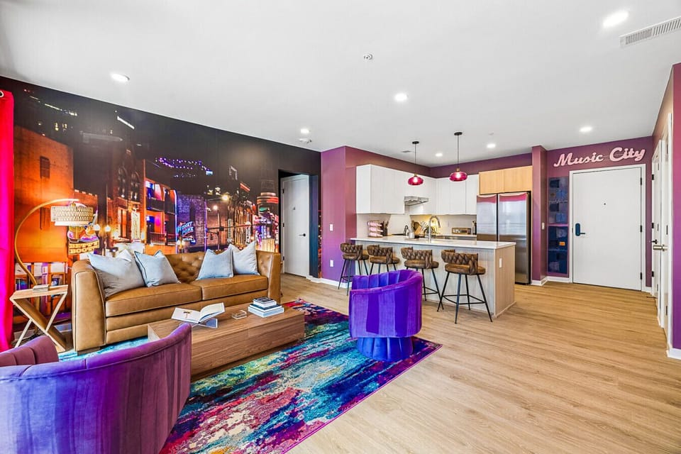 Open concept features a comfortable living space with sofa bed, fully equipped kitchen, Smart TV, patio access, and incredible photo-ops from every angle.
