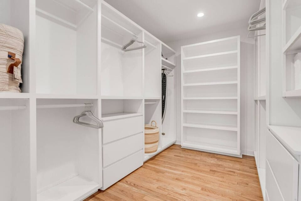 Spacious walk-in closet adjacent to the primary suite.