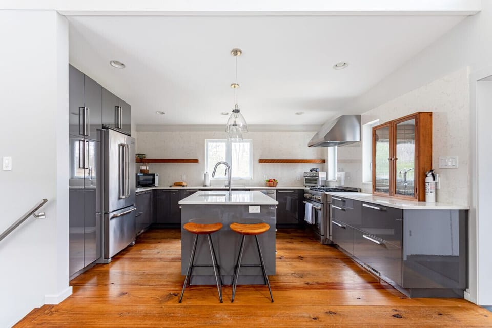 Sleek, modern kitchen that is fully equipped for everything from quick breakfasts to home-cooked meals