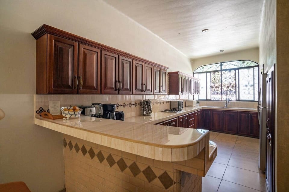 FIRST FLOOR: Large , well equipped Kitchen . With wet bar a couple of feet to the right 