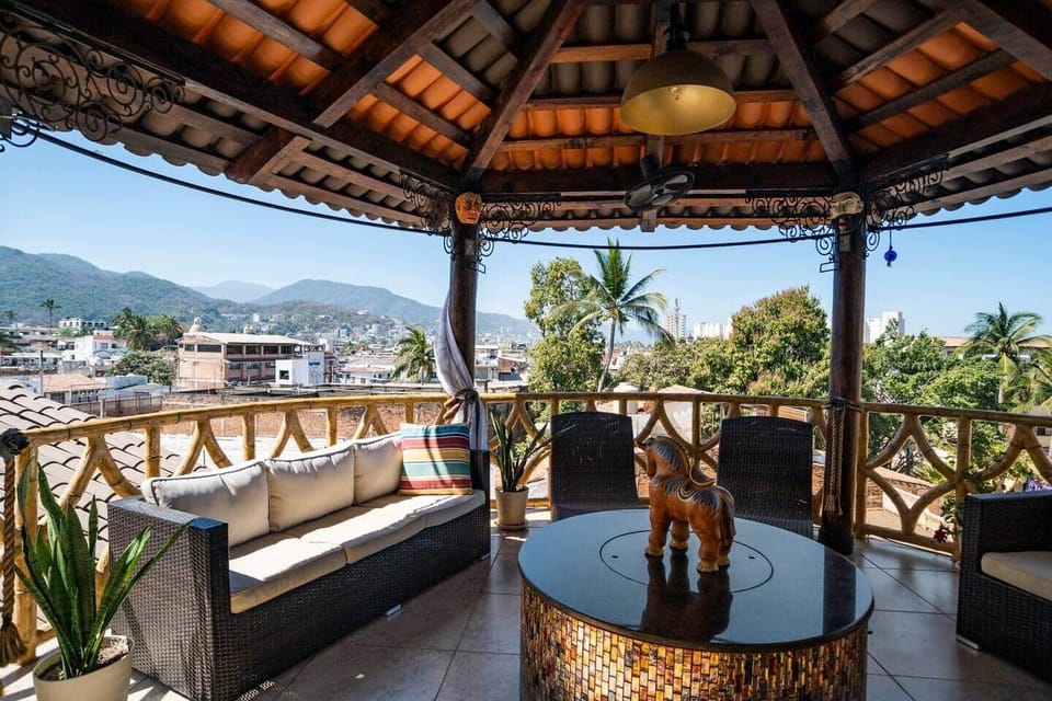 Our beautiful panoramic Gazebo with views of the majestic lush jungle mountains to the East & the city looking southward . The beach is west about a 7 min walk. 