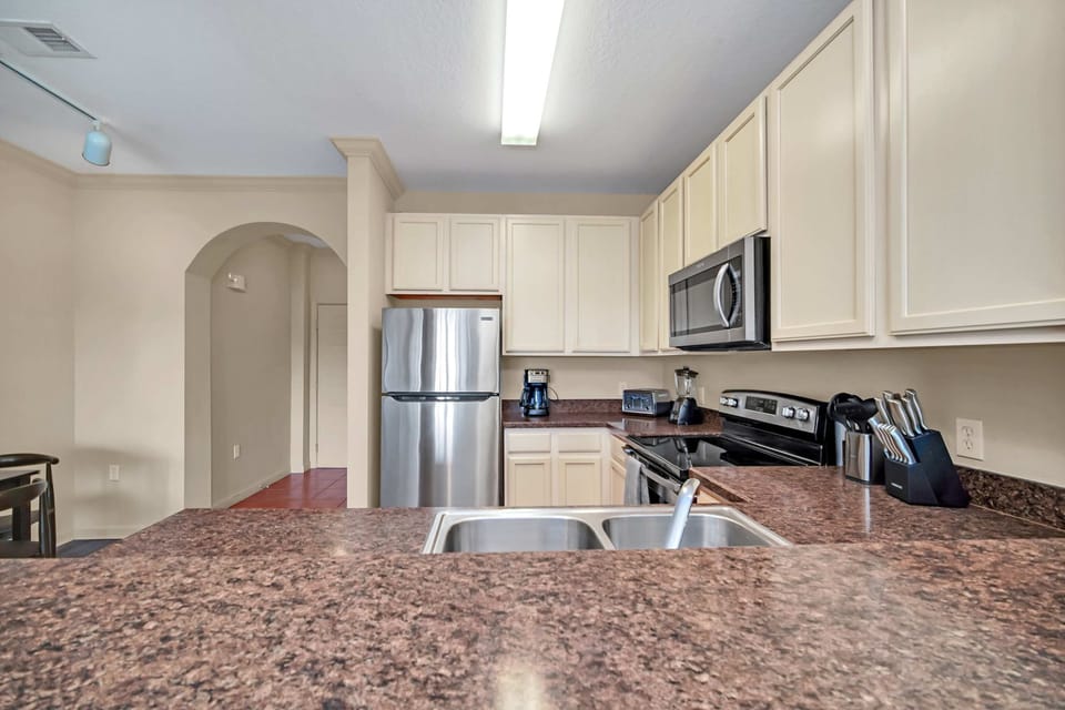 Fully equipped kitchen with silver appliances